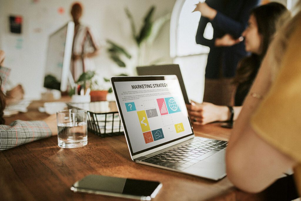 working on ai digital marketing strategy on laptop